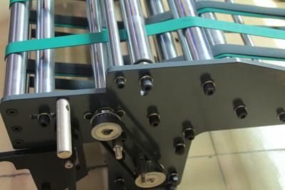 Transportador de papel para máquina plegadora